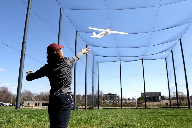 Student launching drone in the drone park